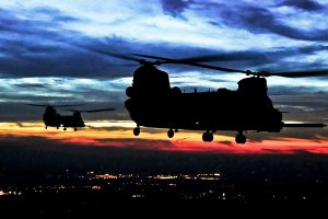 helicopters flying at dusk