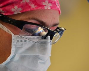 close up of doctors face in surgery