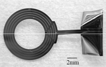 A fabricated intraocular coil, the metal coil is encapsulated between two layers of Parylene C