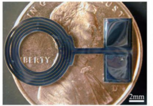 Dual metal layer coil sitting on a penny